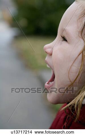girl face kid young red jacket white hood wet View Large Photo Image Picture - girl face kid young red jacket white hood wet. Fotosearch