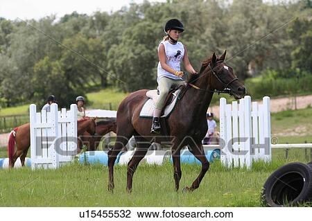 Stock Image -  girl horse children camp in florida for kids. Fotosearch