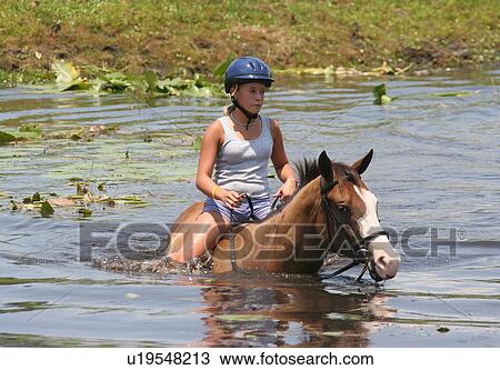 Stock Image -  girl horse children camp in florida for kids. Fotosearch