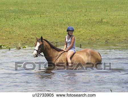 Stock Photography -  girl horse children camp in florida for kids. Fotosearch