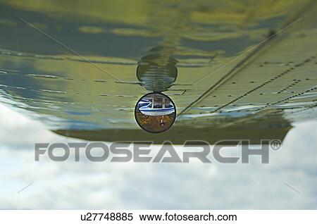 Stock Photography -  image under airplane wing focusing mirror cesna. Fotosearch