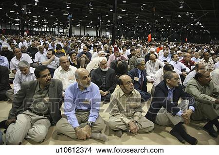 Picture -  love men males muslim gathered praying sitting. Fotosearch