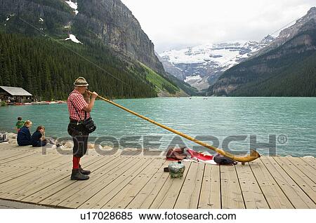 man musican in typical swiss dress playing dock View Large Photo Image Stock Photography - man musican in typical swiss dress playing dock. Fotosearch