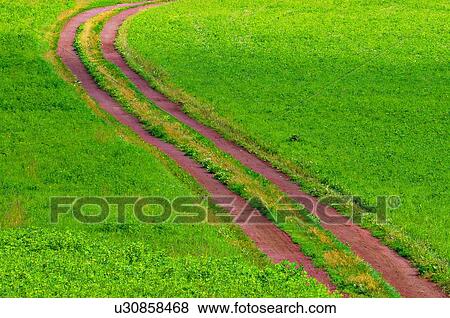 nature winding red earth dirt road through farm View Large Photo Image Stock Photo - nature winding red earth dirt road through farm. Fotosearch
