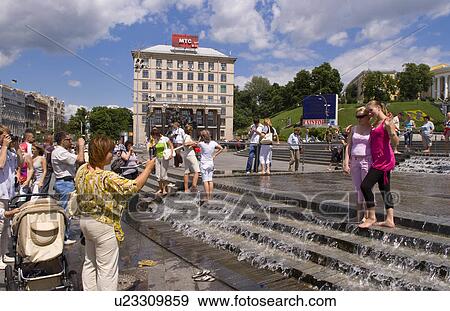 people playing in street fountain taking photo View Large Photo Image Stock Photo - people playing in street fountain taking photo. Fotosearch