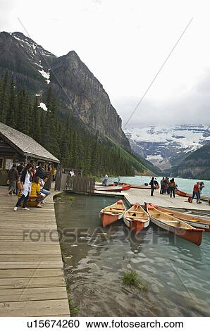 people tourist renting canoes boat around lake View Large Photo Image Stock Image - people tourist renting canoes boat around lake. Fotosearch