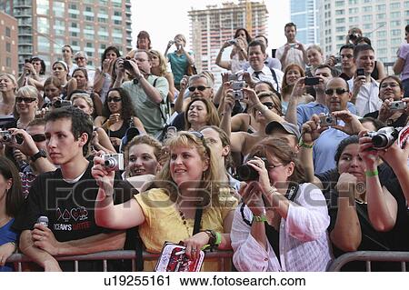 Stock Image -  people women females men males young fans happy. Fotosearch