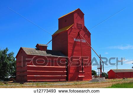 red painted wooden grain elevator stands blue View Large Photo Image Stock Image - red painted wooden grain elevator stands blue. Fotosearch