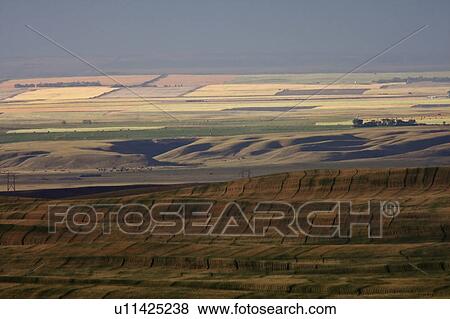 Stock Photo -  scenic view big muddy valley swathes farmland. Fotosearch