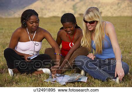 south african girls enjoying magazine howick View Large Photo Image Stock Photography - south african girls enjoying magazine howick. Fotosearch
