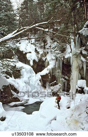 Stock Photo -  sport man snow shoeing bigham falls stowe vt. Fotosearch