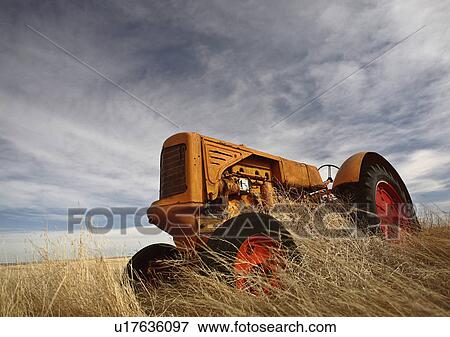 spring art piled abandoned tractor vehicles farm View Large Photo Image Stock Photo - spring art piled abandoned tractor vehicles farm. Fotosearch