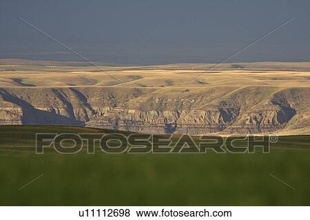 summer big muddy valley clouds sunlit shadows View Large Photo Image Stock Photo - summer big muddy valley clouds sunlit shadows. Fotosearch