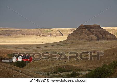 summer castle butte in big muddy valley clouds View Large Photo Image Stock Image - summer castle butte in big muddy valley clouds. Fotosearch