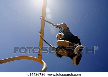 summer sun young boy below swings high swing sky View Large Photo Image Stock Photograph - summer sun young boy below swings high swing sky. Fotosearch