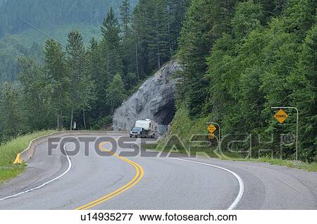 truck camper passing through rock tunnel highway View Large Photo Image Stock Photo - truck camper passing through rock tunnel highway. Fotosearch