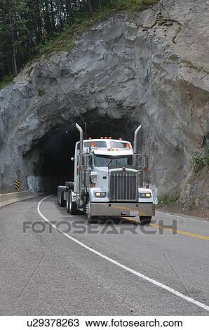 Stock Image -  truck traveling highway 3 in british columbia. Fotosearch