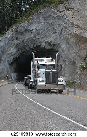 Stock Image -  truck traveling highway in british columbia road. Fotosearch