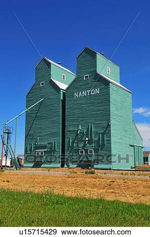 Stock Photo -  vertical scenic image twin grain elevators . Fotosearch