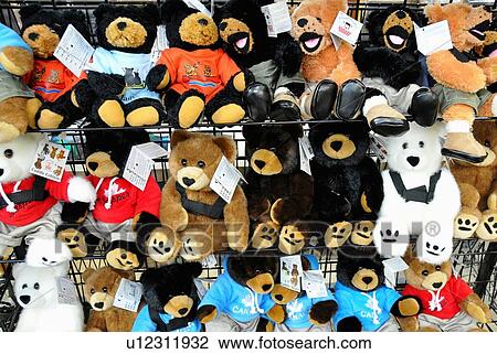 Stock Image -  wall rack full lovable toy teddy bears . Fotosearch