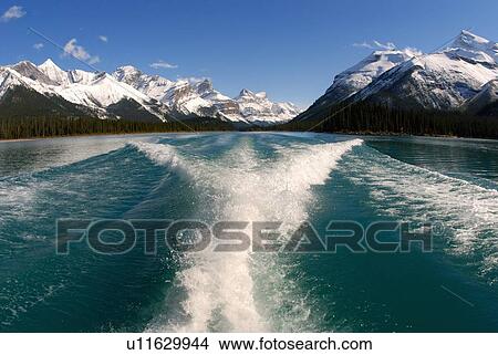 Picture -  water looking back flowing aquawa colored snow. Fotosearch
