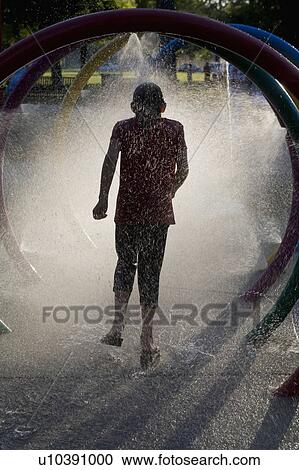 water summer girl sun runs through backlit spary View Large Photo Image Stock Image - water summer girl sun runs through backlit spary. Fotosearch