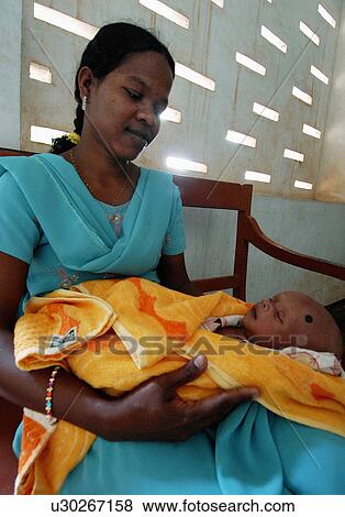 Stock Photo -  woman baby photos various locations in india son. Fotosearch