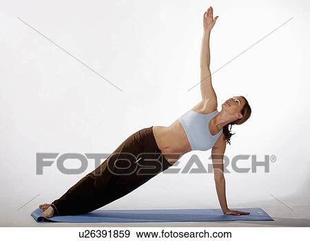 woman beautiful sexy young practices yoga mat View Large Photo Image Stock Photo - woman beautiful sexy young practices yoga mat. Fotosearch