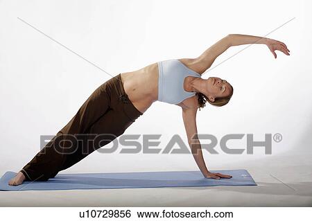 woman beautiful sexy young practices yoga mat View Large Photo Image Stock Photograph - woman beautiful sexy young practices yoga mat. Fotosearch