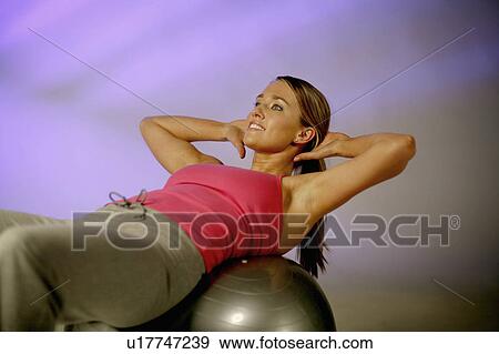 Stock Photo -  woman fitness sport beauty beautiful young sit. Fotosearch