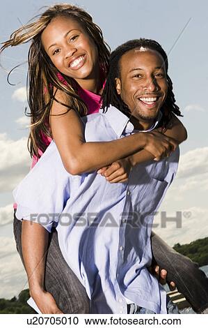 Stock Image -  woman girl couple man happy young teen teens boy. Fotosearch