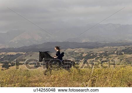 woman horse beauty pretty rides through pasture View Large Photo Image Stock Photo - woman horse beauty pretty rides through pasture. Fotosearch