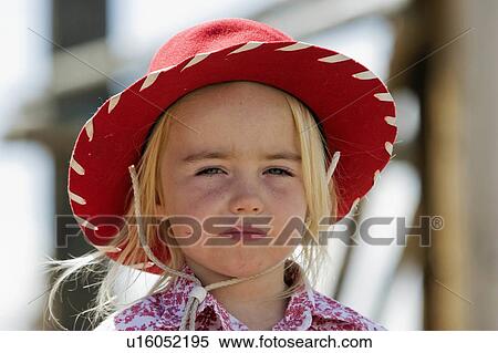 Stock Photography -  woman horse young cowgirl sits atop ranch . Fotosearch