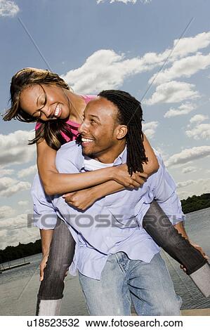 Stock Image -  woman love tree couple man nature beautiful fun. Fotosearch