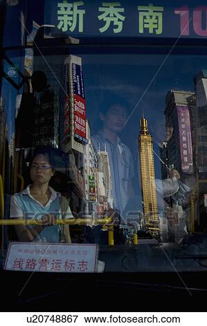 woman man asia surreal china reflection downtown View Large Photo Image Stock Photo - woman man asia surreal china reflection downtown. Fotosearch