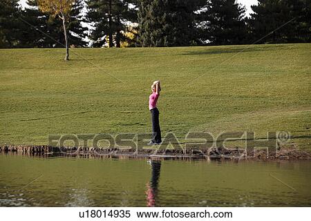 Stock Photography -  woman spring sexy athletic young stretches yoga. Fotosearch