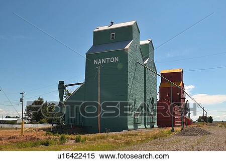 Stock Photography -  wooden grain elevators sit in line town nanton. Fotosearch