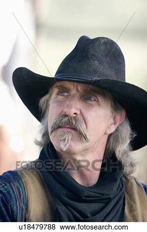 Stock Photo -  working cowboy ranch in colorado hat bandanna. Fotosearch