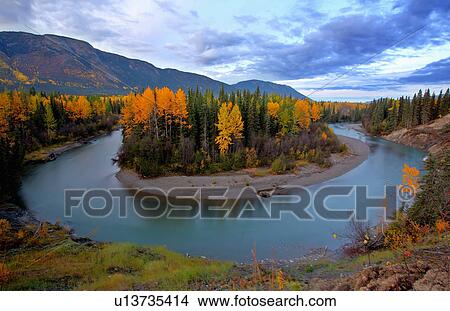 Picture -  autumn colors tanzilla river in northern british. Fotosearch