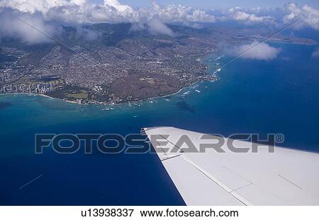 Stock Photo -  beach aerial airplane famous waikiki in honolulu. Fotosearch