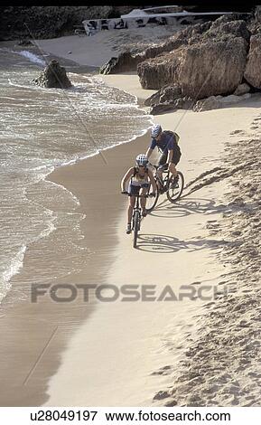 Stock Photo -  beach people sport radsport biking aktiv ausflug. Fotosearch
