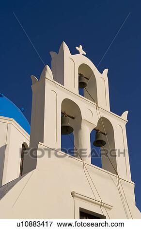 Stock Photo -  beautiful village oia white old bell tower. Fotosearch