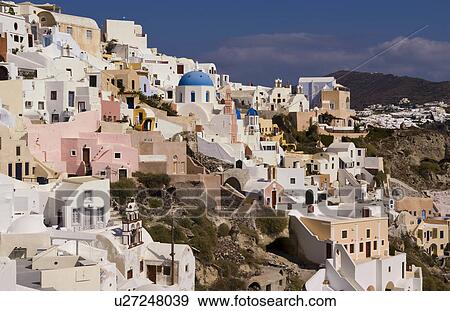 Stock Photo -  beautiful village oia white old buildings down. Fotosearch