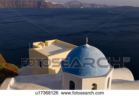 Stock Photograph -  beautiful village oia white old buildings down. Fotosearch