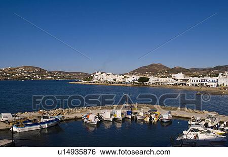 Stock Photograph -  boats in harbor center city parikia capital. Fotosearch