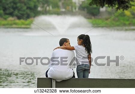 buttonwood park father enjoys moment View Large Photo Image Stock Photo - buttonwood park father enjoys moment . Fotosearch