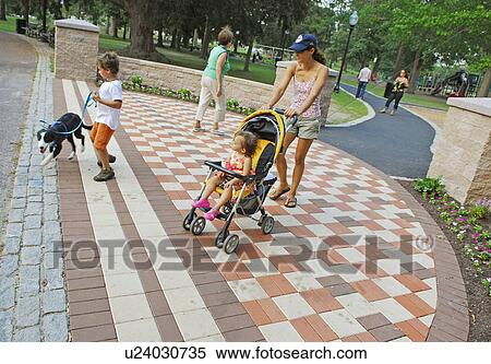 Stock Photography -  buttonwood park mother enjoys walk in. Fotosearch