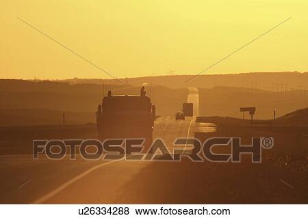 car sun glare trans canada highway sign semi View Large Photo Image Stock Photo - car sun glare trans canada highway sign semi. Fotosearch
