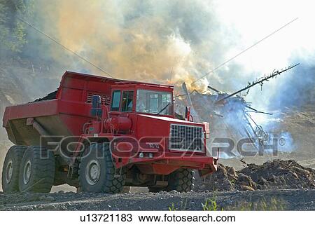 Stock Image -  construction off road rock truck hauling load. Fotosearch