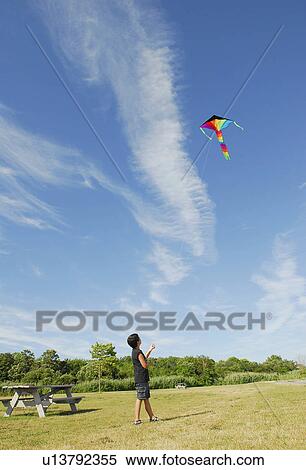 fairhaven kite feature young boy flies View Large Photo Image Stock Photography - fairhaven kite feature young boy flies. Fotosearch